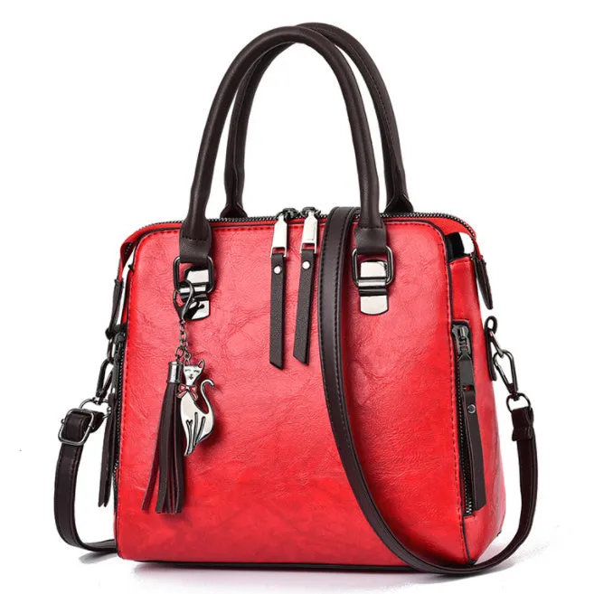 Sophie  Vintage Handtasche aus veganem Leder mit Fransen und Obergriff