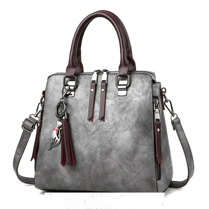 Sophie  Vintage Handtasche aus veganem Leder mit Fransen und Obergriff