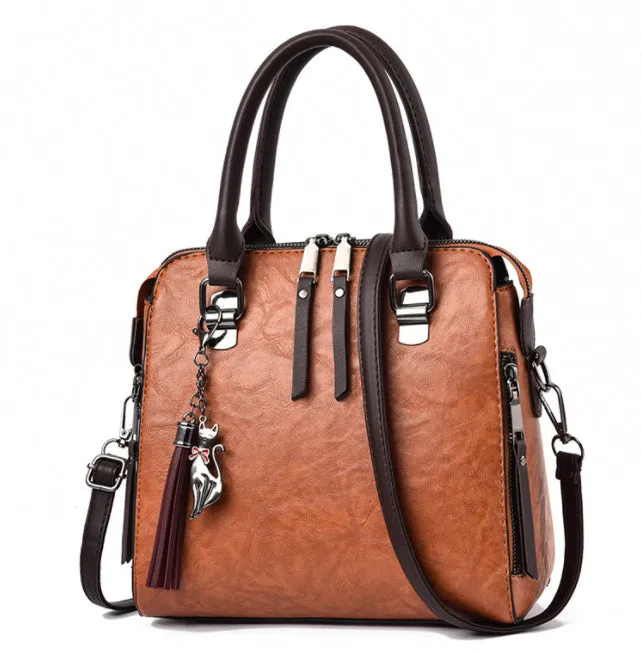 Sophie  Vintage Handtasche aus veganem Leder mit Fransen und Obergriff