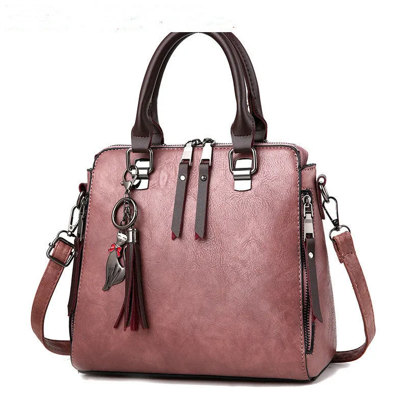 Sophie  Vintage Handtasche aus veganem Leder mit Fransen und Obergriff