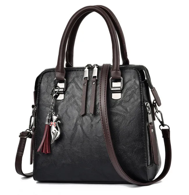 Sophie  Vintage Handtasche aus veganem Leder mit Fransen und Obergriff