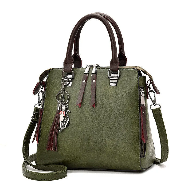 Sophie  Vintage Handtasche aus veganem Leder mit Fransen und Obergriff